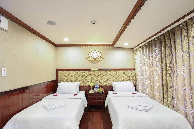 2-Day Oriental Sails Junk Cruise of Halong Bay - Day 1: Sung Sot Cave and Titop Island, with sunset built in