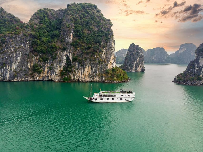 From Hanoi: 2-Day Ha Long Bay Boat Tour - Day 1: Sung Sot Cave, Titop Island Views, and Spring Rolls Onboard
