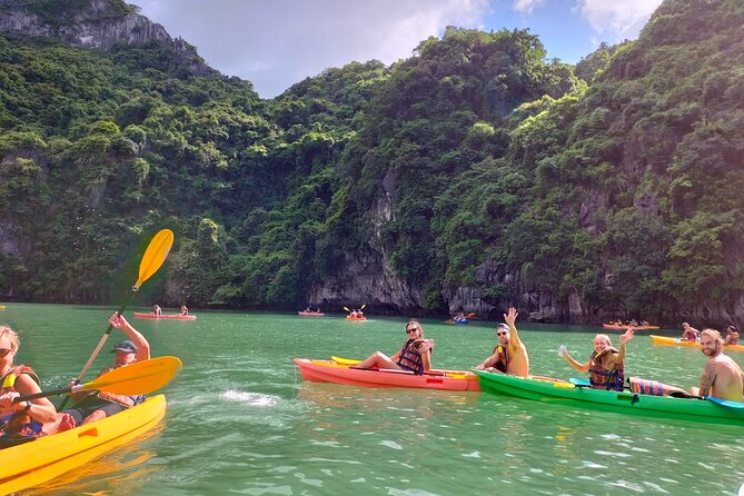 Ha Long Bay Cruise Day Tour - Cave, Kayaking, Swimming & Lunch - Hang Luon Cave Kayaking: Calm Water and Limestone Walls
