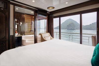 Overnight Luxury 5 Star Alisa Cruise with Meals, Kayak or Bamboo Boat - Day 1 through Ha Long Bay: caves, floating village pass-bys, and a sunset bar